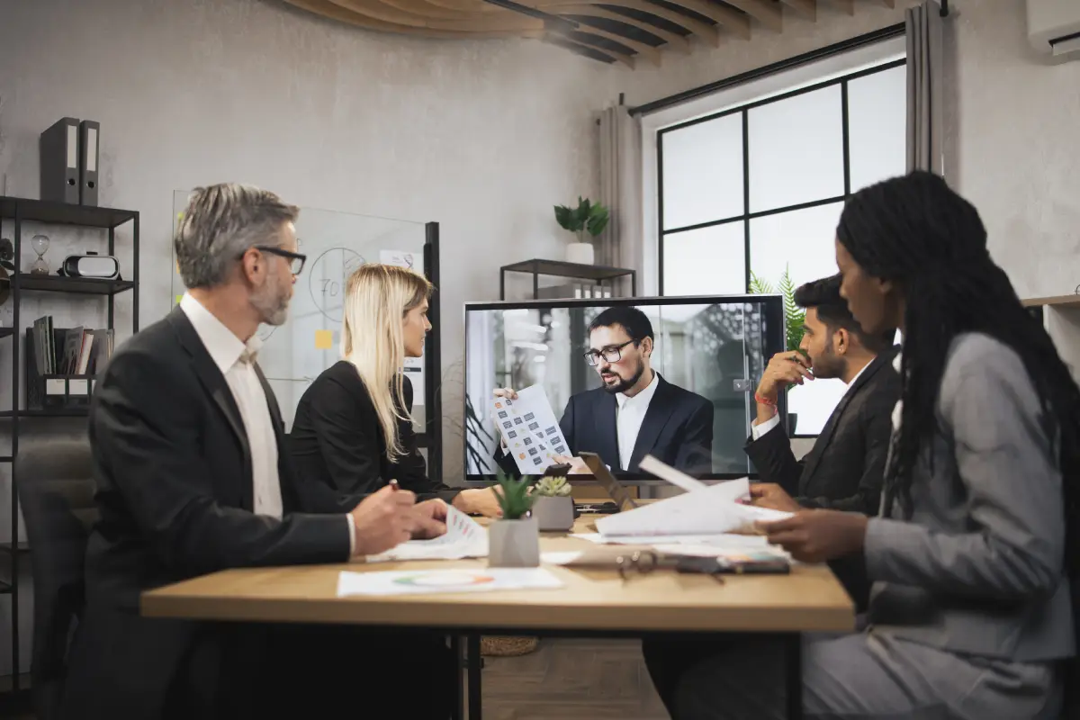business-colleagues-in-meeting-with-remote-associate