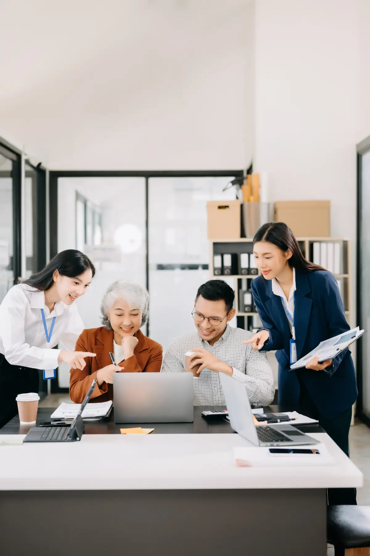 professionals-working-together-on-a-laptop-at-office